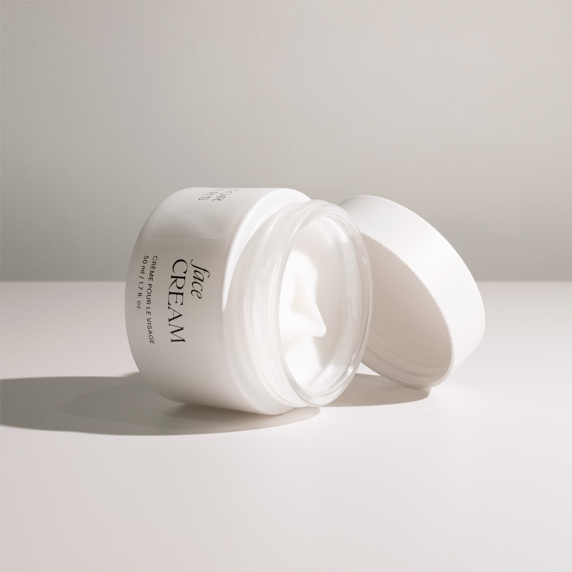 Doctor Rogers Skincare | Restore Face Cream | Best hydrating Face Cream to reduce wrinkles while hydrating skin. Perfect for all skin types - including sensitive, dry, mature, acne-prone skin. 
Pictured: 1.7 fl oz eco-friendly, sustainable, recyclable packaging white jar rolled over to display texture.