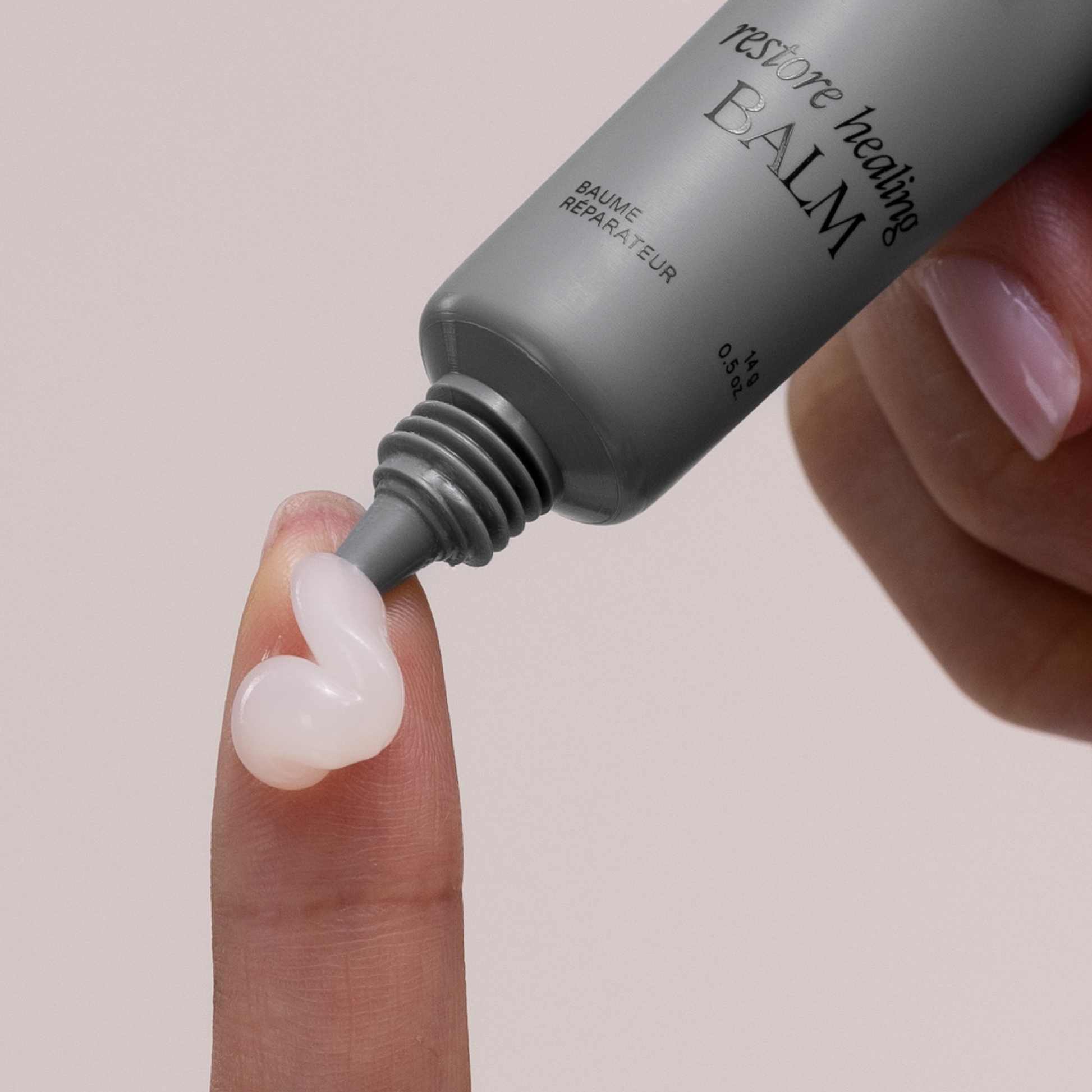 Doctor Rogers Restore Healing Balm applied to finger showing clear gel texture made with Castor Oil to hydrate and heal skin