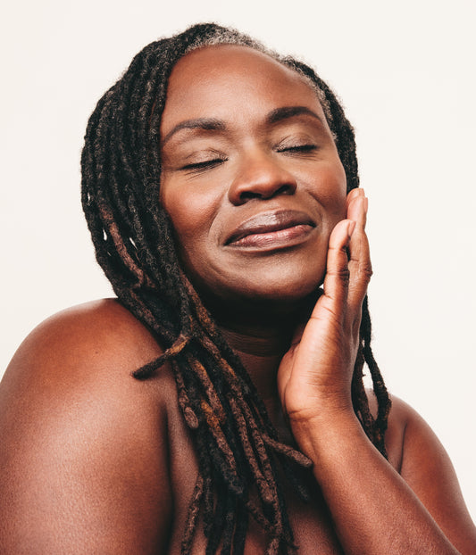 Women in her 50's as the cover photo of Expert Dermatologist Heather D. Rogers, blog "Dermatologist Explains: Skincare in Your 50s: Menopause Changes Everything"