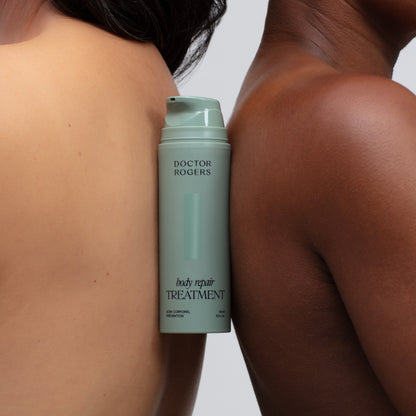 Doctor Rogers Body Repair Treatment | Best body serum designed to smooth crepey skin, restore hydration, diminish wrinkles and even skin tone. 

Made with the best and most powerful skincare ingredients including glycolic acid and bakuchiol to reduce wrinkles, dark spots and fine lines.

Picture featuring eco-friendly green 5oz tube between two womens backs. 