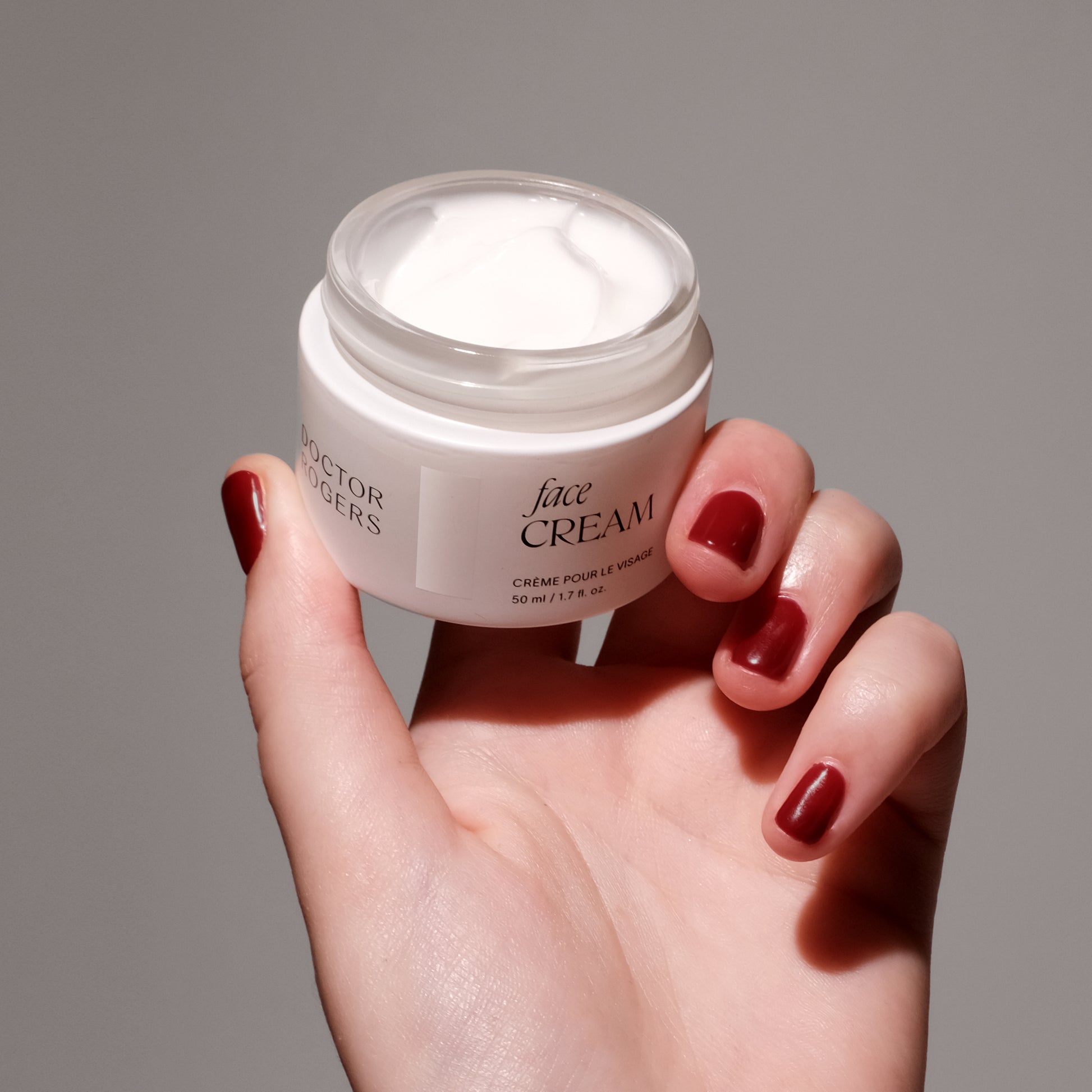 Hand holding the Best moisturizing Face Cream for wrinkle prevention.