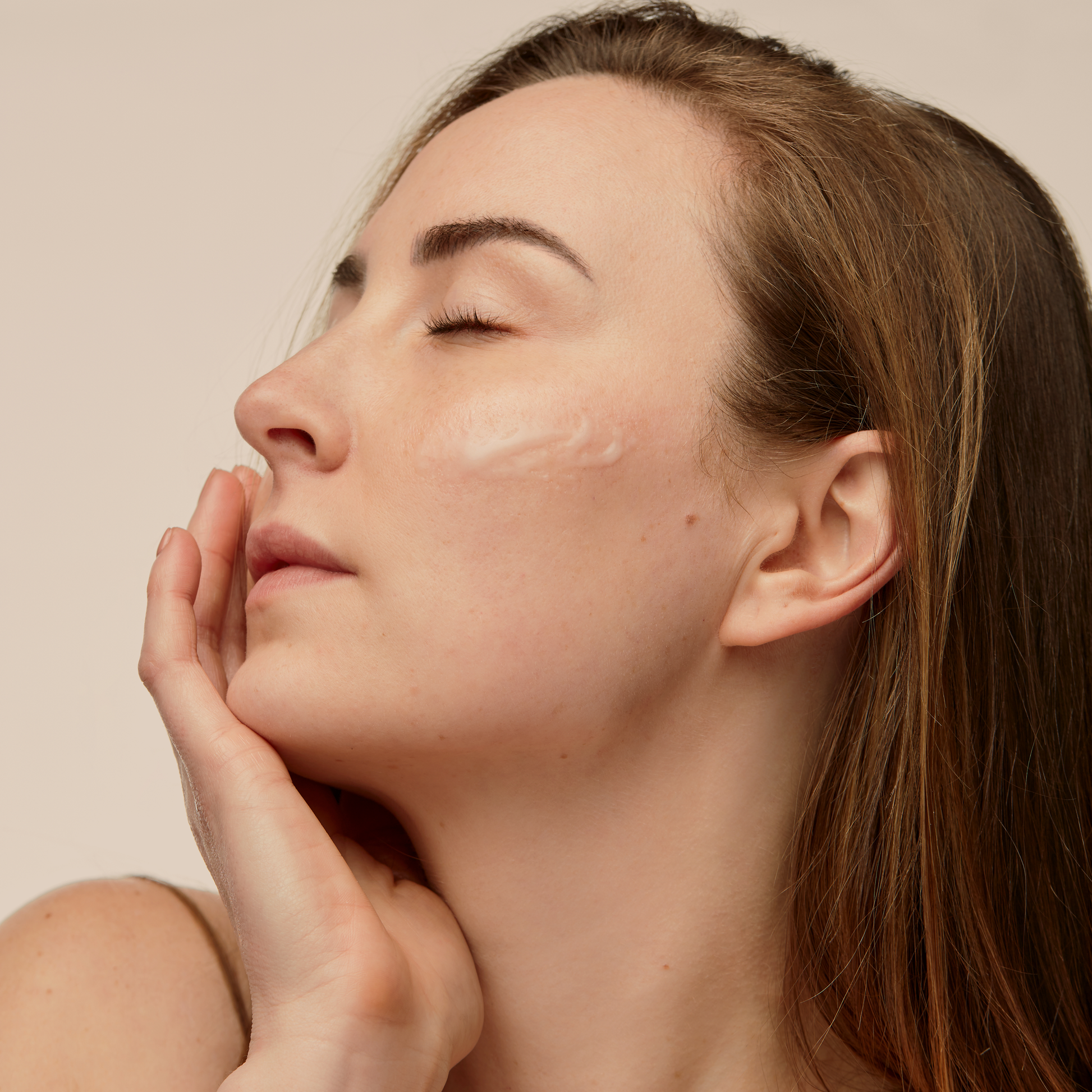 Women applying face brightening best daytime serum on face
