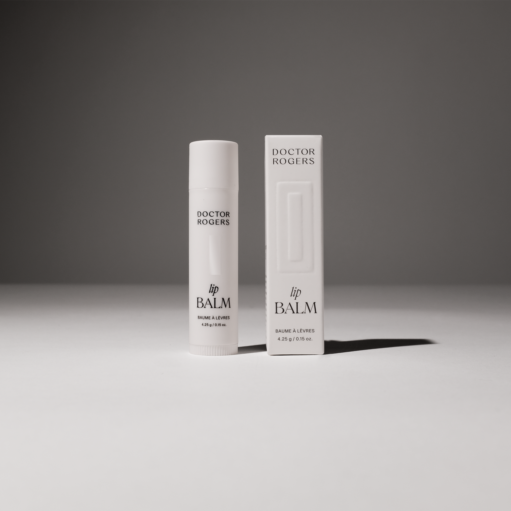 Best lip balm for men and women with dry lips next to the recyclable packaging the product ships in