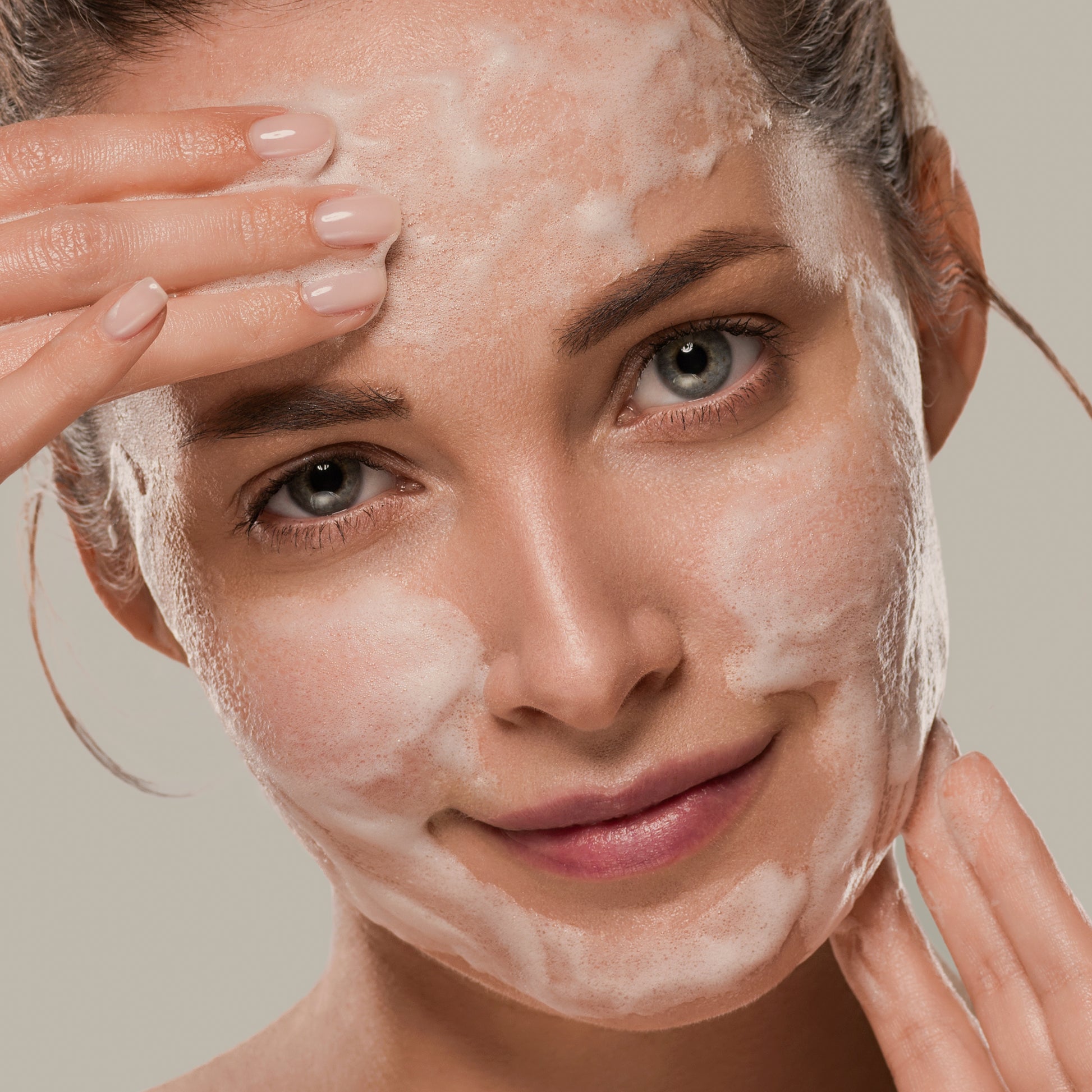 Women cleansing face with gentle, natural facewash good for sensitive, dry skin.
